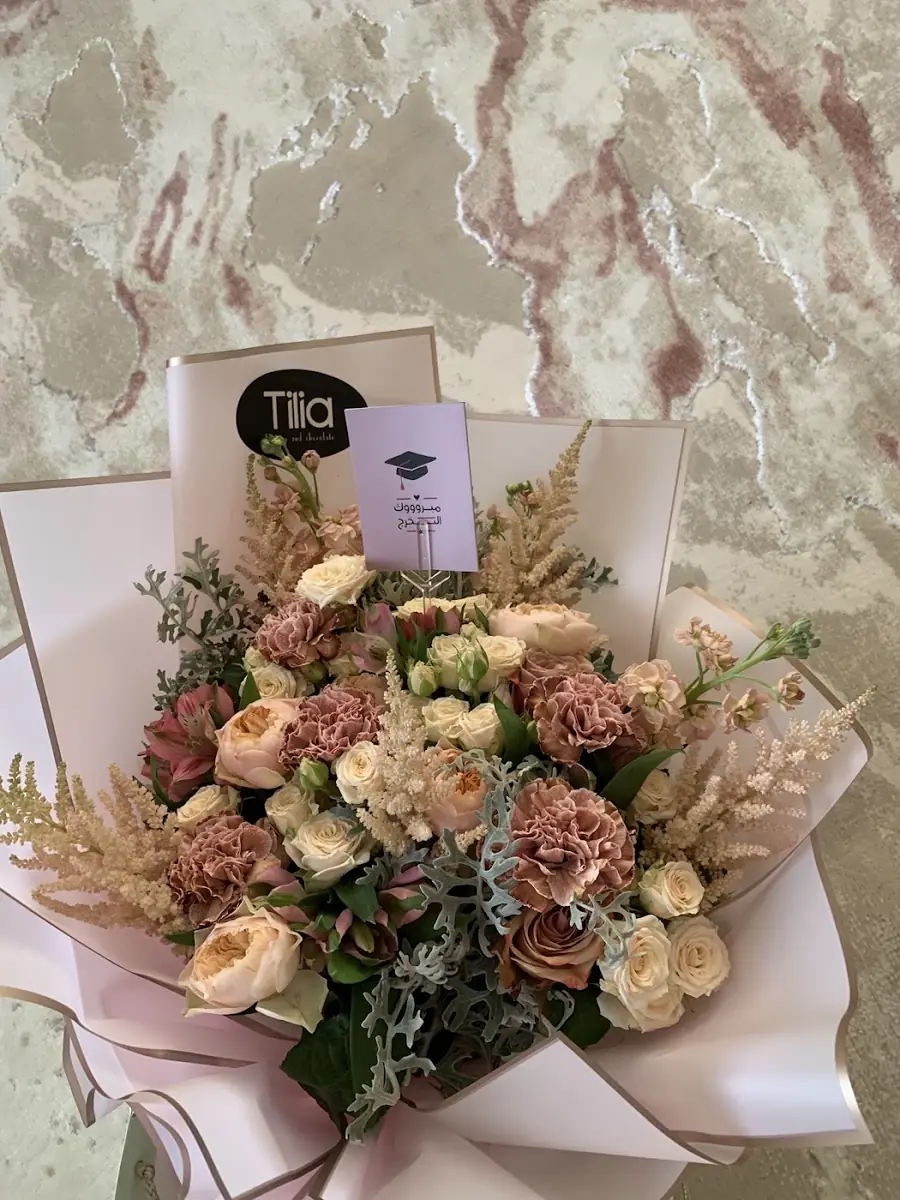 A bouquet with a graduation cap card