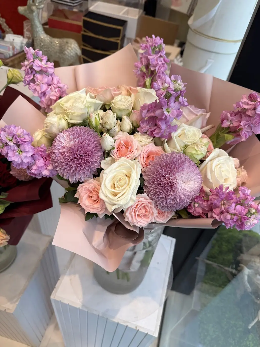 A lilac and white bouquet made at Tilia