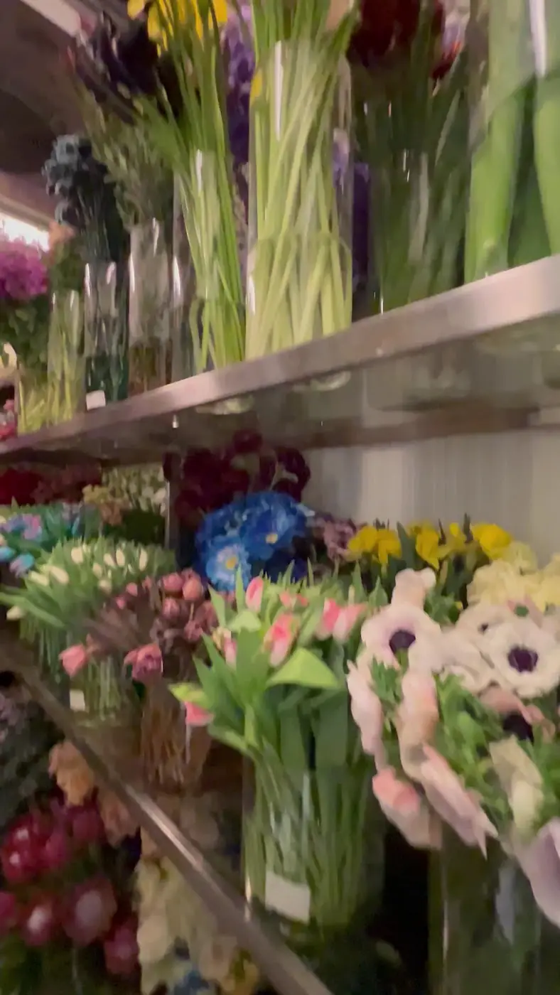 Vases, gifts and fresh flowers on the shelves inside Tilia